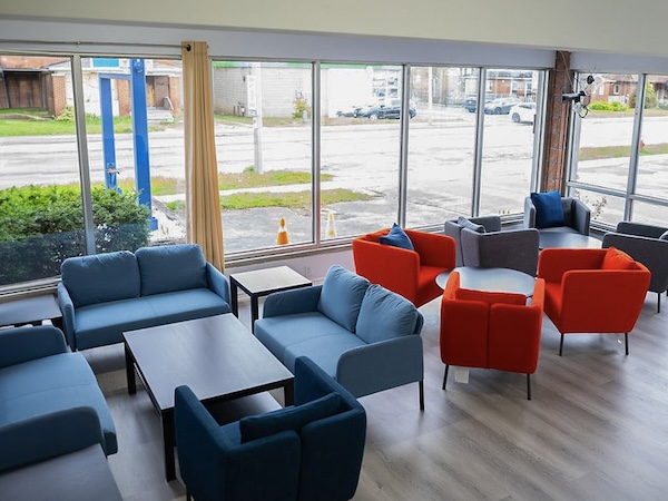 Common area with blue and red couch.