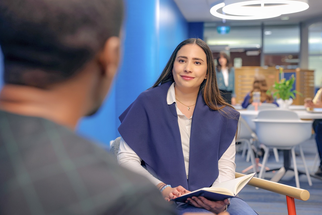 Young professional engaged in conversation