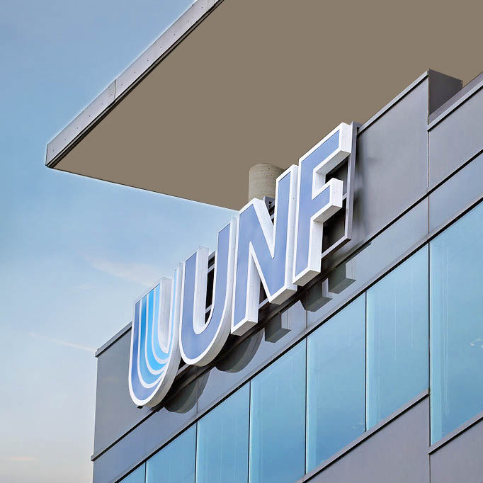 UNF logo prominently displayed on the side of a modern building