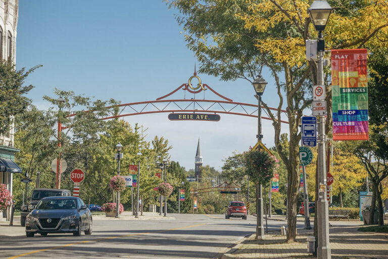 car drives along a Queen street, Niagara Falls, Canada