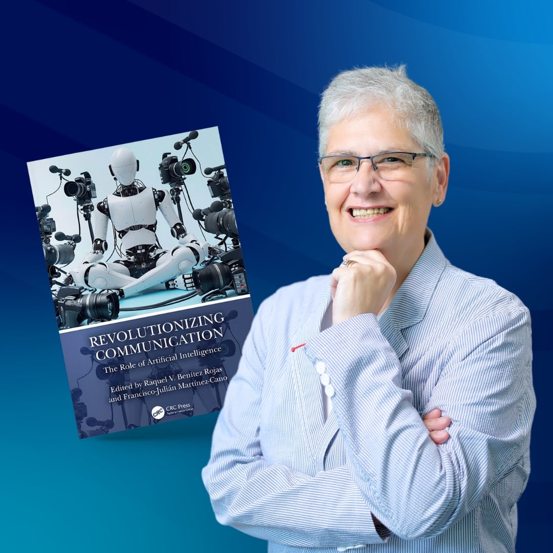 A woman wearing glasses stands beside a book on robotics